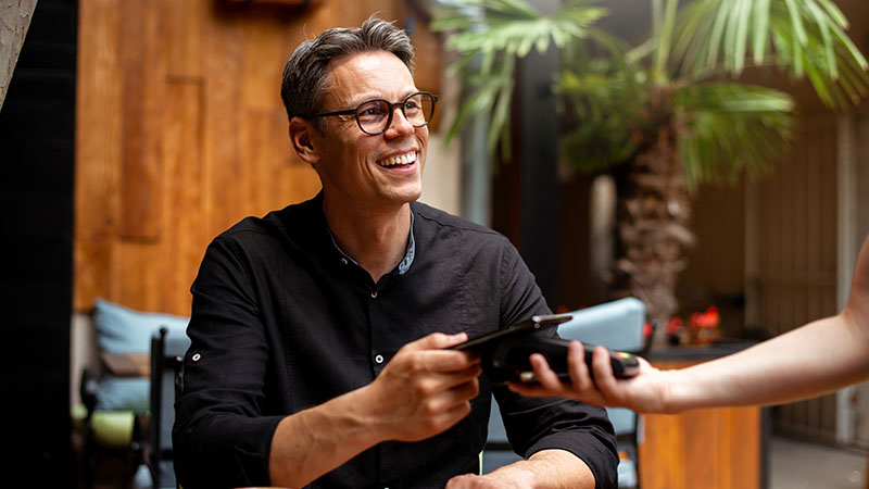 man paying with card